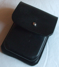  A black card case with a
nickle sam brown fitting